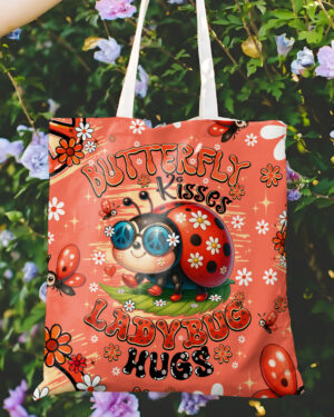Front view of the Butterfly Kisses ladybug tote bag with vibrant colors and playful design.