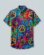 Front view of colorful burst paw print shirt showcasing vibrant tie-dye and paw prints on a short-sleeve design.