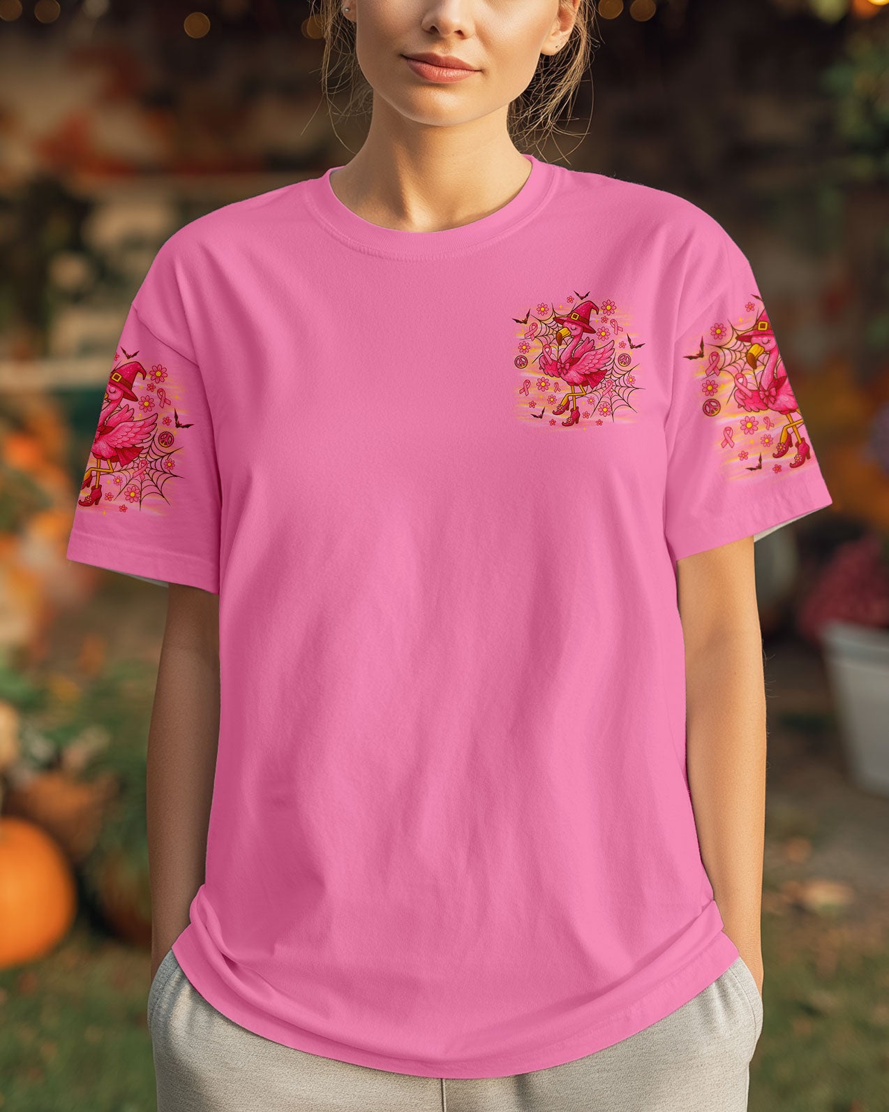Pink Flamingo Witch Shirt | All Over Print Clothes Front view showcasing the pink flamingo witch shirt with colorful Halloween artwork and bold lettering.