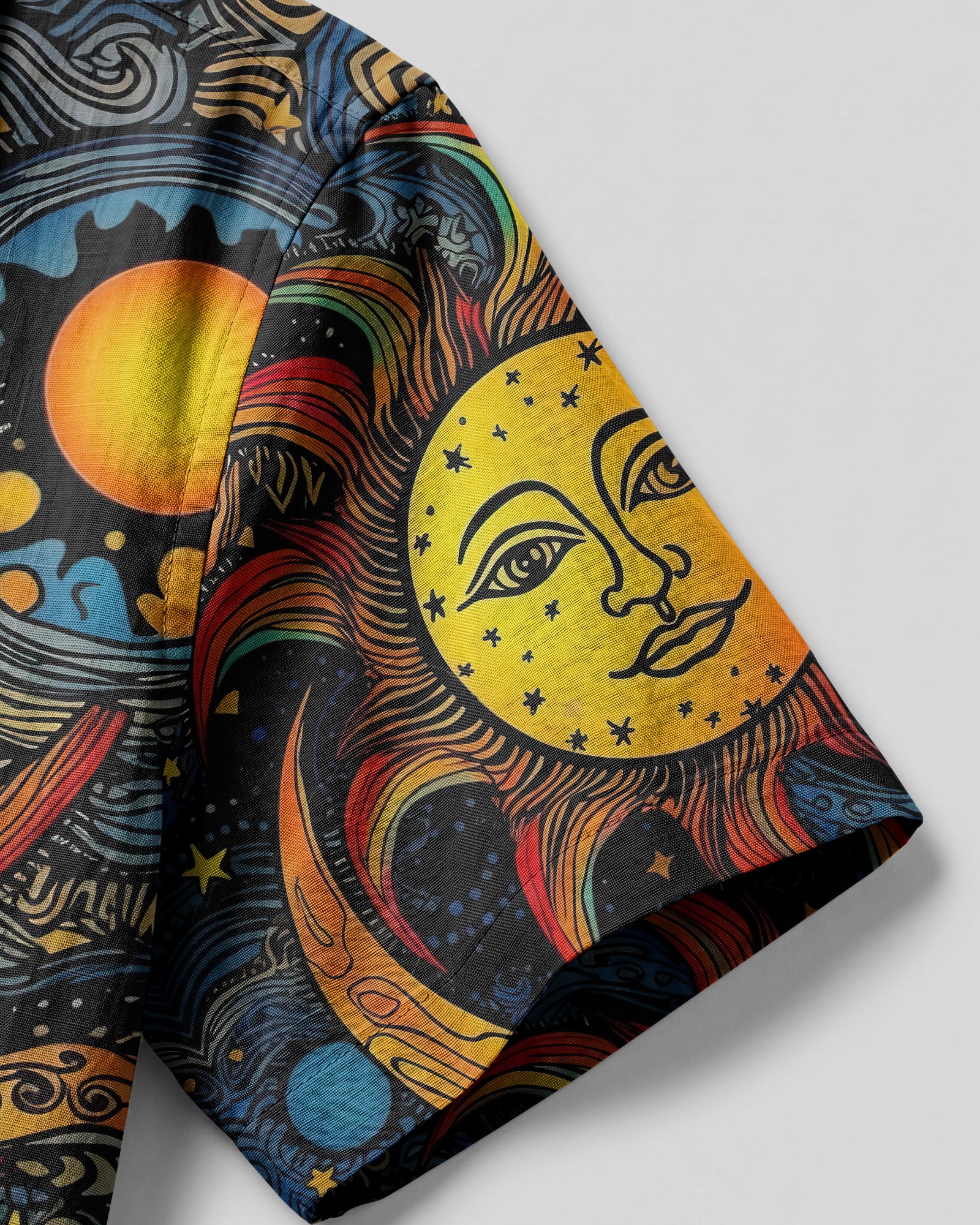 Sun and Moon Camp Shirt Close-up detail of the sun and moon camp shirt highlighting the vivid colors and unique patterns in the fabric.