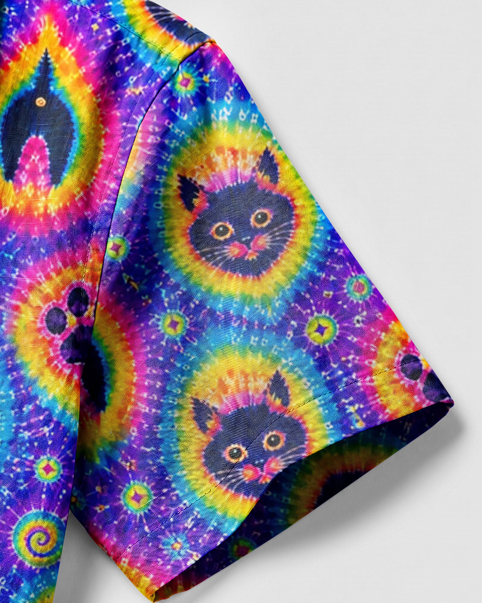 Funny Cat Paw Print Camp Shirt Close-up detail of the funny cat paw print camp shirt highlighting unique cat faces and paw prints in vivid colors.