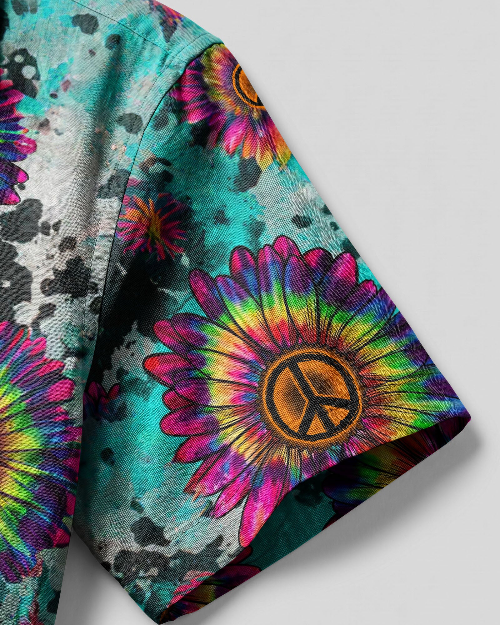 Sunflower Tie Dye Peace Camp Shirt Lifestyle shot of a person wearing the sunflower tie dye peace camp shirt at a beach, radiating summer vibes.