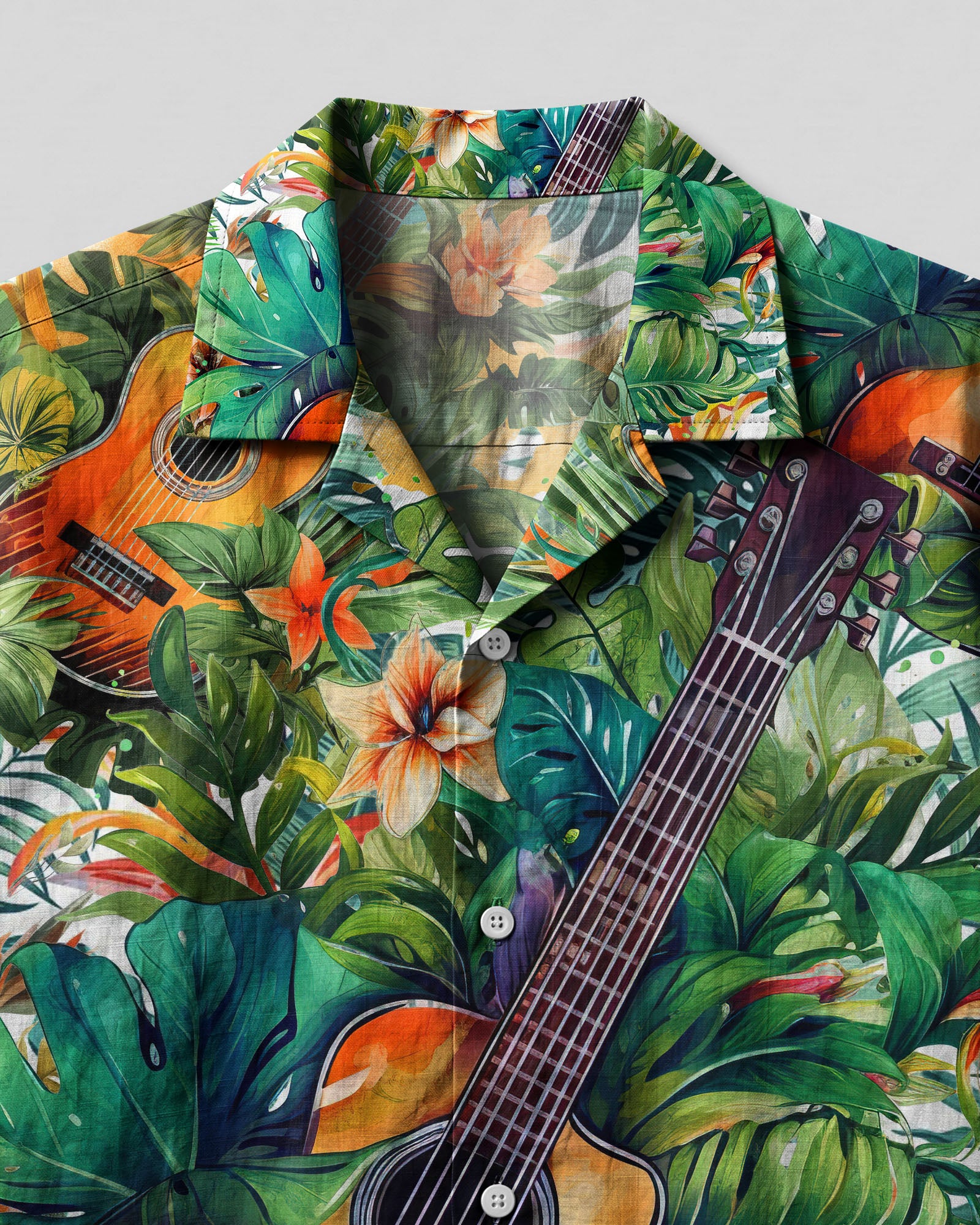 Guitar Tropical Camp Shirt Close-up detail of the guitar tropical camp shirt highlighting the intricate leaf and flower designs.