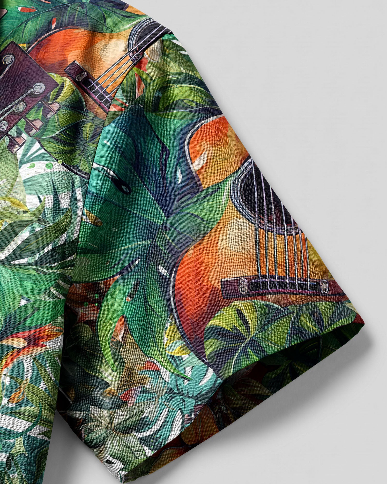 Guitar Tropical Camp Shirt Lifestyle shot of a person wearing the guitar tropical camp shirt at a beach, surrounded by palm trees.
