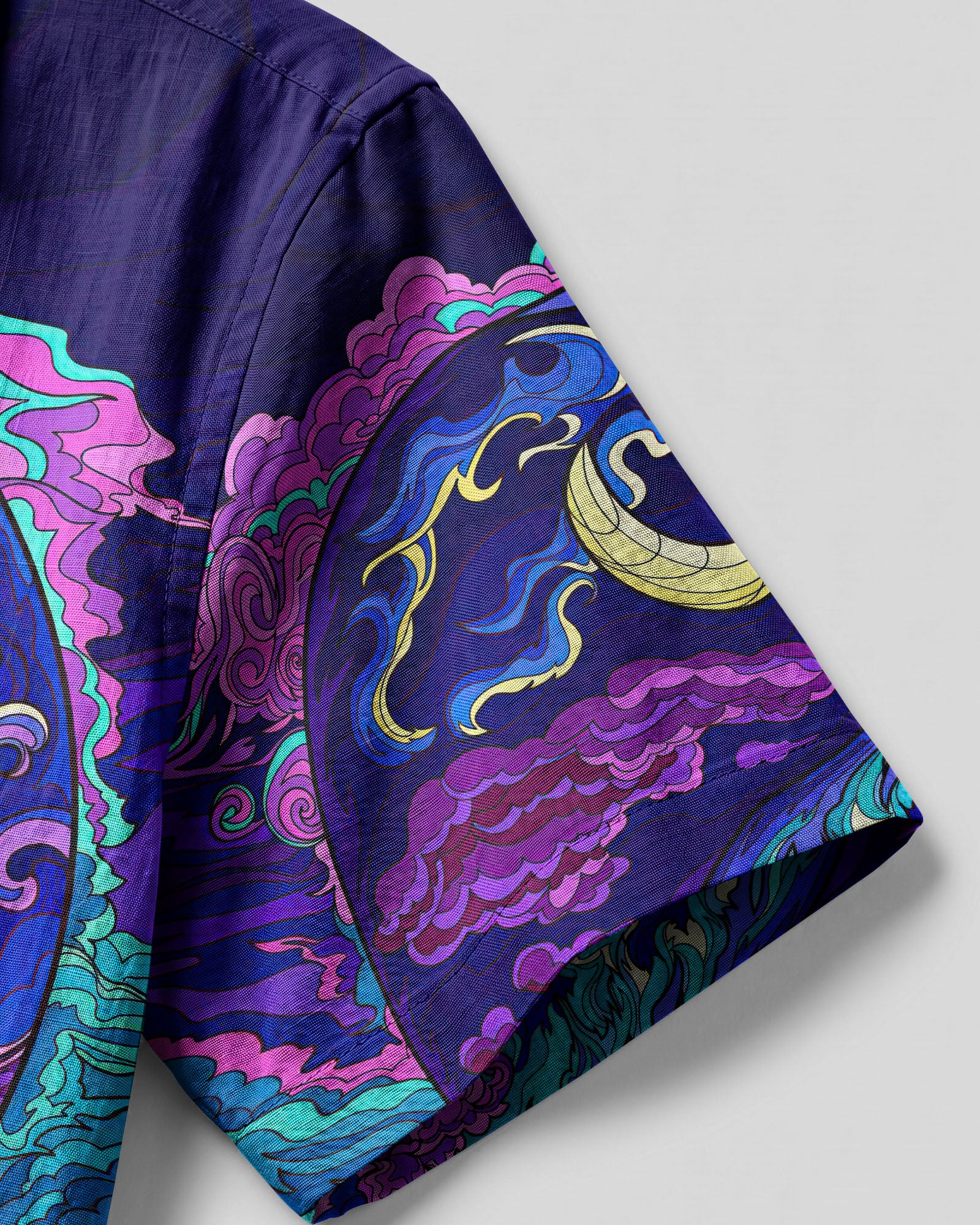 Yin Yang Moon and Sun Psychedelic Hawaiian Shirt Lifestyle shot of a person wearing the yin yang moon and sun psychedelic camp shirt outdoors, surrounded by nature.