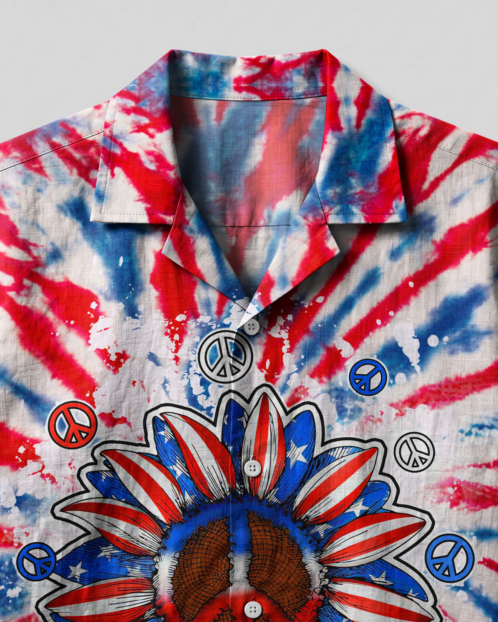 Peace Y'All Sunflower America Tie Dye Camp Shirt Close-up detail of the peace y'all sunflower america tie dye camp shirt's sunflower and peace symbols design.