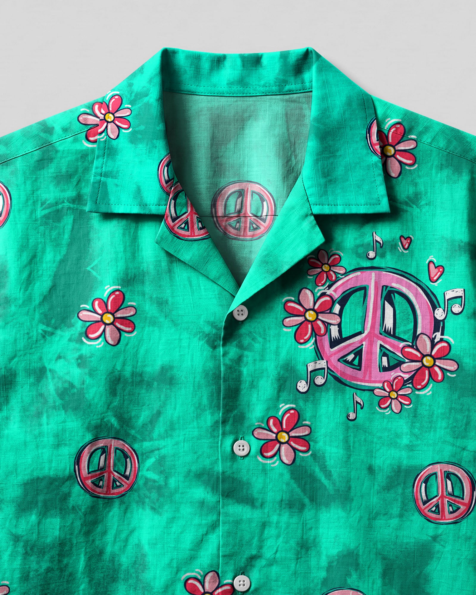 Let's Go Girls Flamingo Camp Shirt Close-up detail of the let's go girls flamingo camp shirt highlighting the unique peace sign and flower motifs.