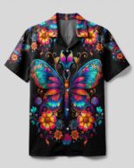 Front view of the just believe camp shirt featuring vibrant butterfly and floral designs on a black background.