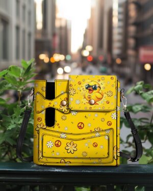 Front view of the playful duck leather tumbler storage bag, featuring a vibrant yellow design with floral accents.