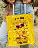 Front view of the I'M NOT SHORT DUCK HIPPIE TOTE BAG with vibrant yellow design and cute duck graphic.