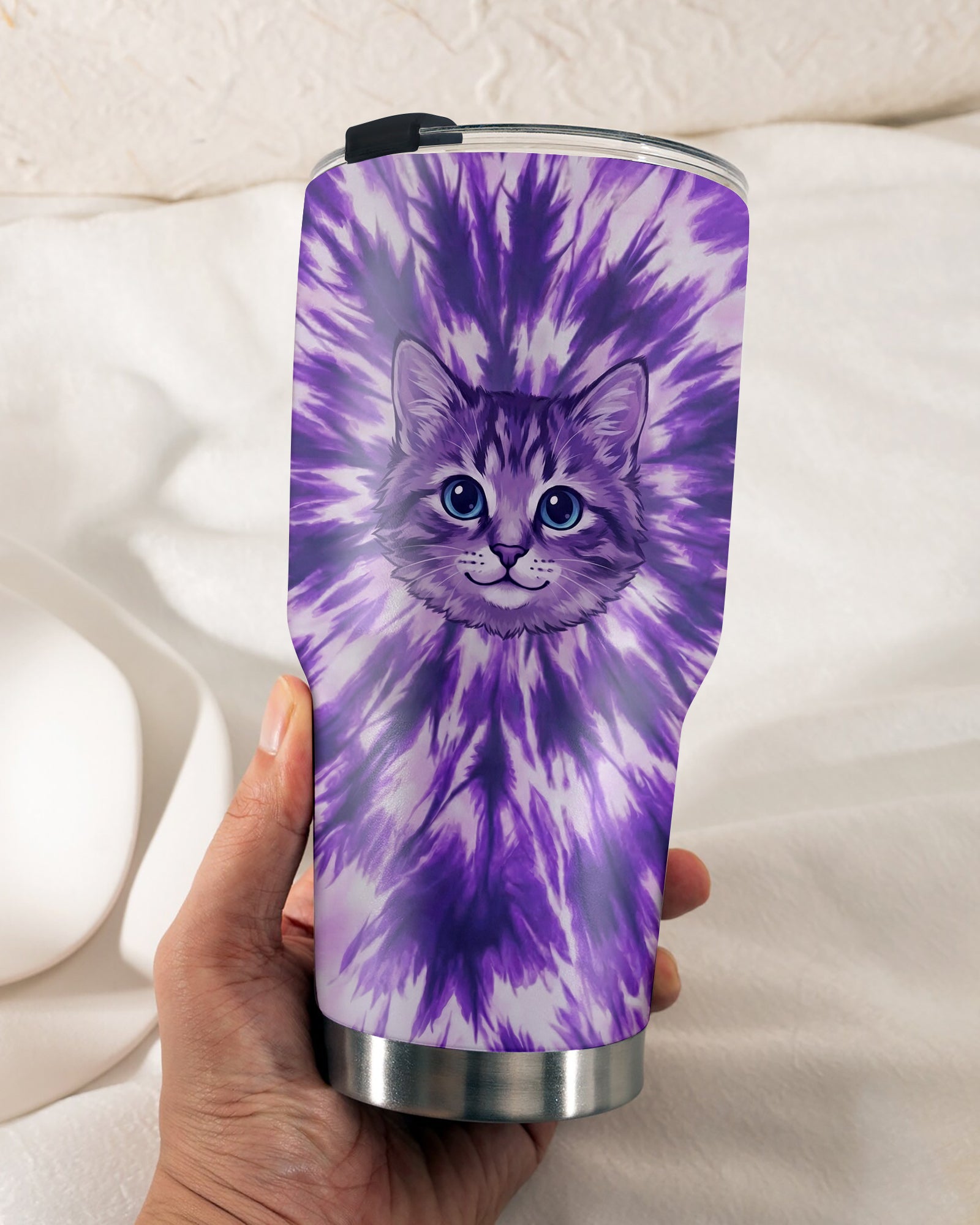 Purple Aura Cat Tumbler | Vibrant Cat Design Lifestyle shot of the purple aura cat tumbler held by a person, featuring a colorful tie-dye pattern.