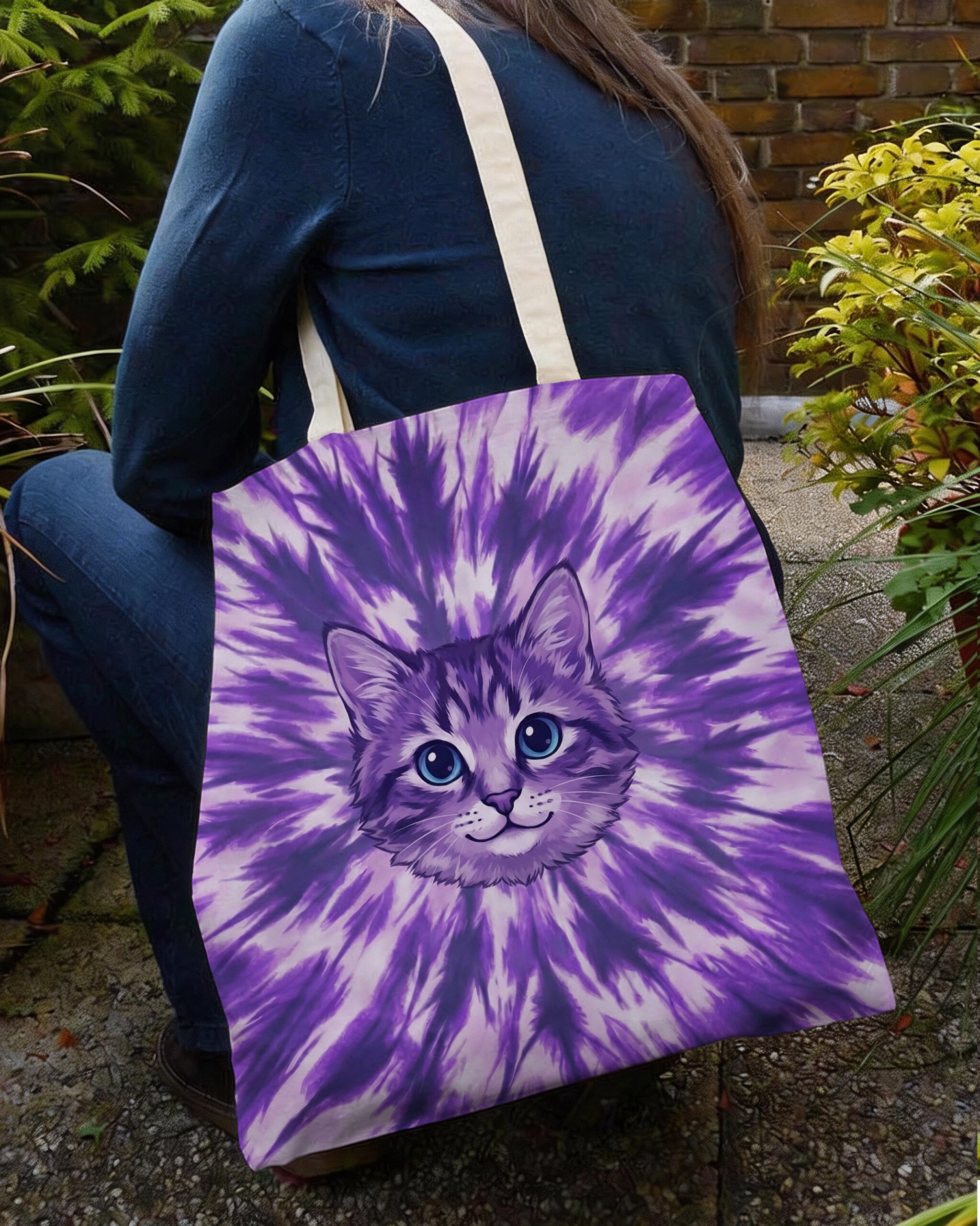 Purple Aura Cat Tote Bag Purple aura cat tote bag with vibrant tie-dye design, showcasing a cute cat face from a side angle.