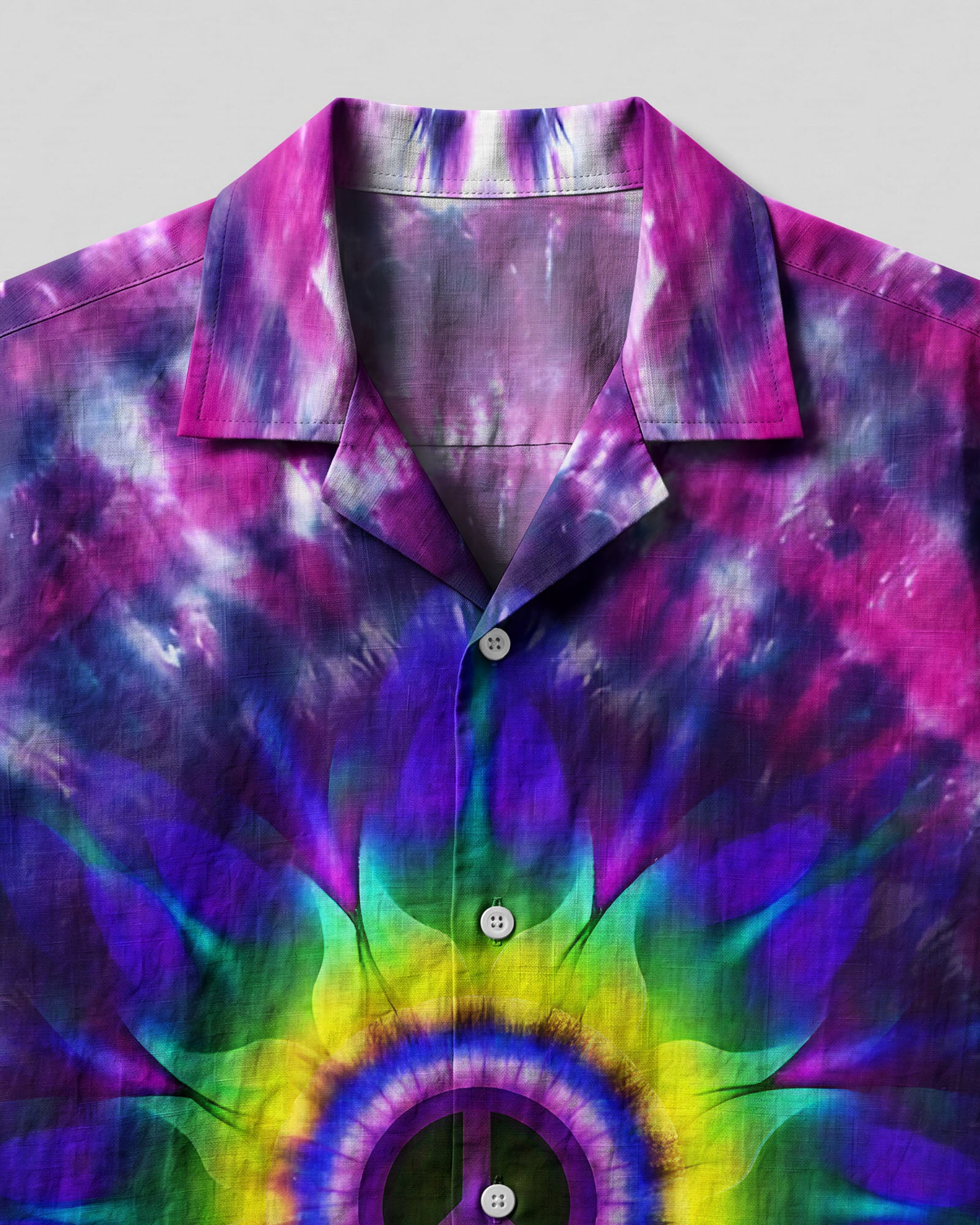 Peace Y'All Tie Dye Camp Shirt Close-up detail of the Peace Y'All Tie Dye Camp Shirt's fabric, featuring intricate tie-dye swirls and colors.