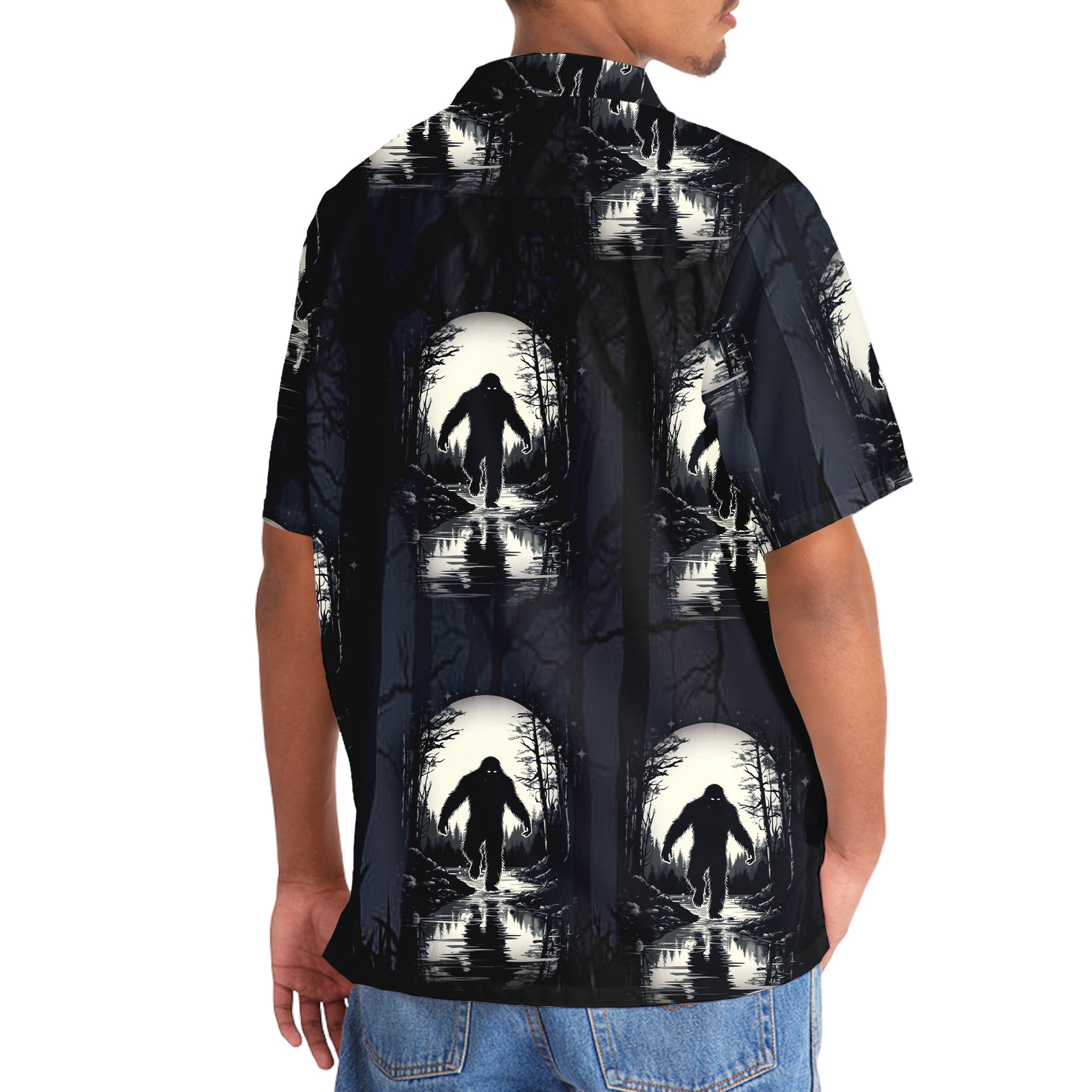 Bigfoot in Moonlight Hawaiian Shirt Flat lay of the Bigfoot in Moonlight Hawaiian shirt on a wooden surface, displaying its striking design and colors.