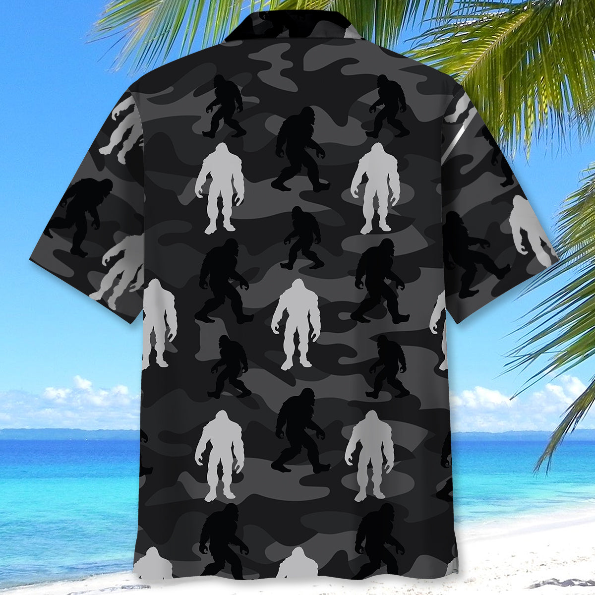 Bigfoot Camo Grey Hawaiian Shirt Lifestyle shot of a person wearing the bigfoot camo grey Hawaiian shirt at the beach, enjoying the sun.