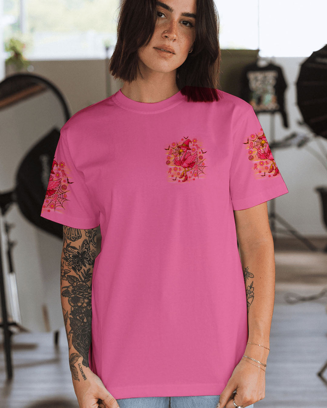 Pink Flamingo Witch Shirt | All Over Print Clothes Detail shot of the pink flamingo witch shirt highlighting the intricate floral designs and spider webs.