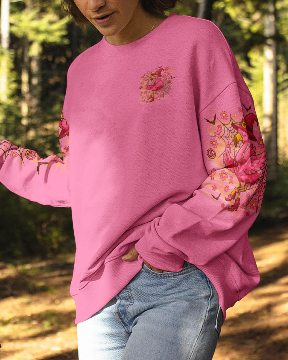Pink Flamingo Witch Shirt | All Over Print Clothes Back detail of the pink flamingo witch shirt featuring sparkling elements and breast cancer awareness ribbons.