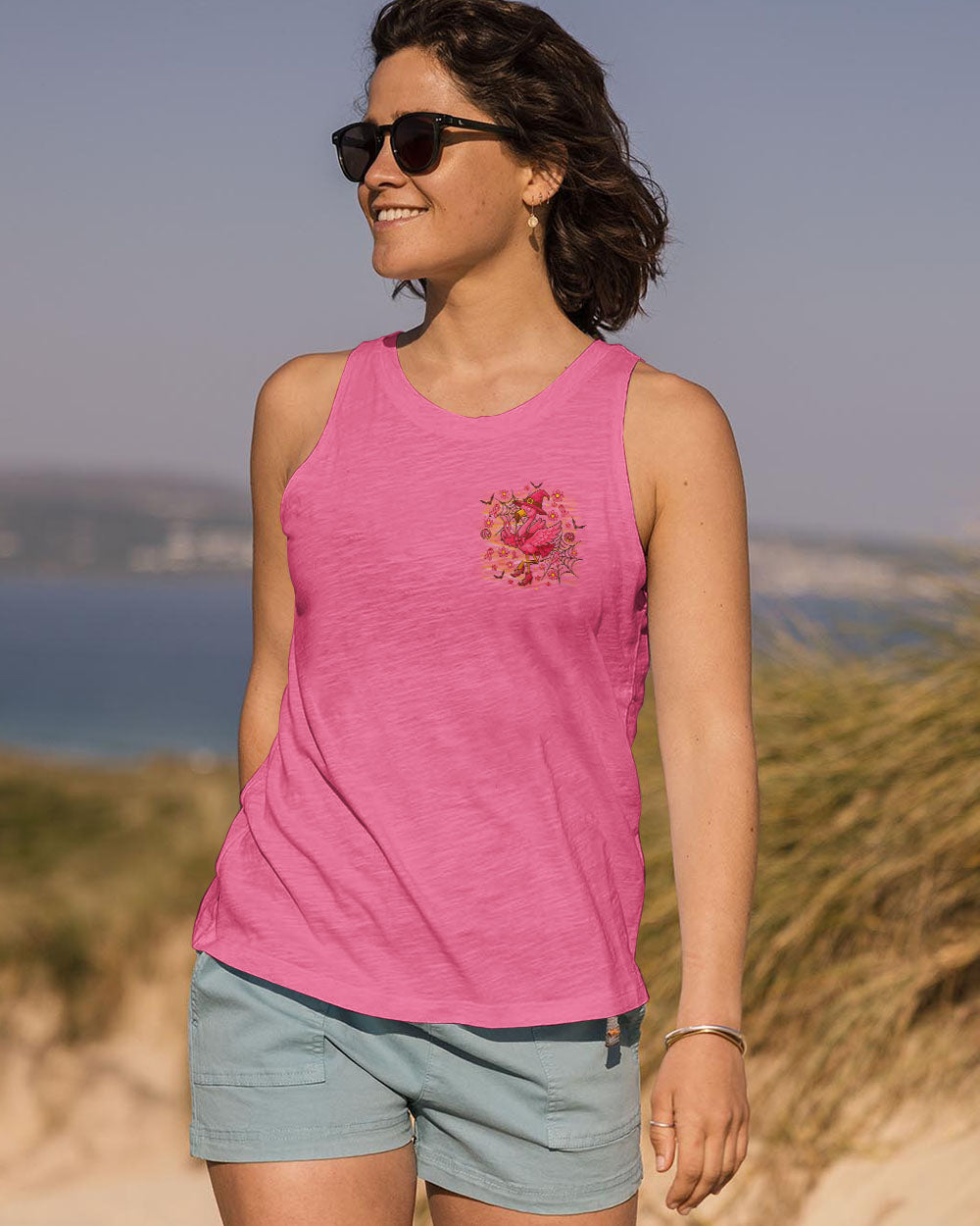 Pink Flamingo Witch Shirt | All Over Print Clothes Focus on the pink flamingo witch shirt’s graphics, featuring a whimsical flamingo and Halloween elements.