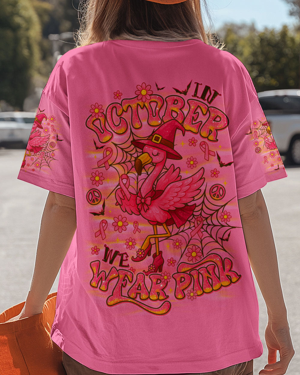 Pink Flamingo Witch Shirt | All Over Print Clothes Angled view of the pink flamingo witch shirt displaying the playful flamingo character and bright colors.