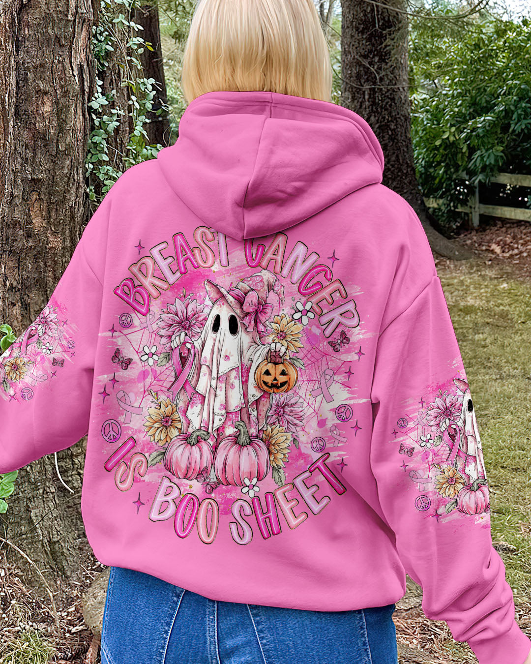 Breast Cancer Is Boo Sheet Shirt | All Over Print Model wearing the breast cancer is boo sheet shirt in a scenic outdoor setting, showcasing its festive vibe.