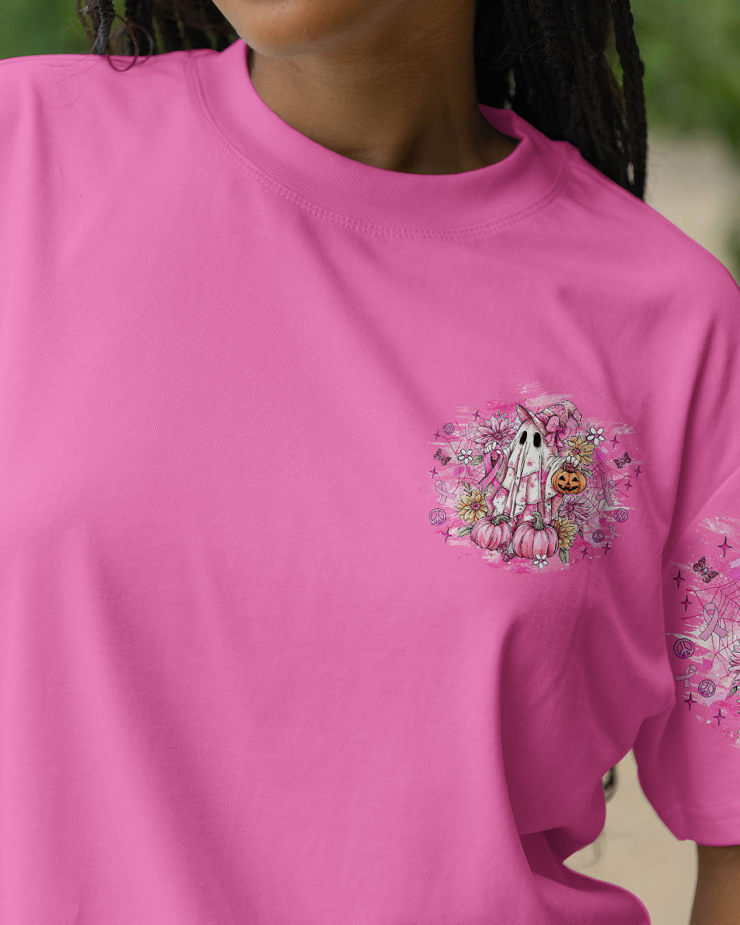Breast Cancer Is Boo Sheet Shirt | All Over Print Back angle of the breast cancer is boo sheet shirt showcasing the colorful design with flowers and a spooky ghost.