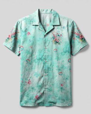 Front view of the just breathe butterfly camp shirt in mint green with floral and butterfly designs.