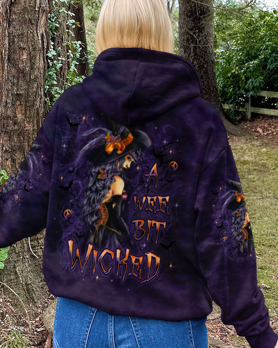 A Wee Bit Wicked Witch Shirt | All Over Print Back detail of the a wee bit wicked witch shirt featuring the whimsical witch and colorful text elements.