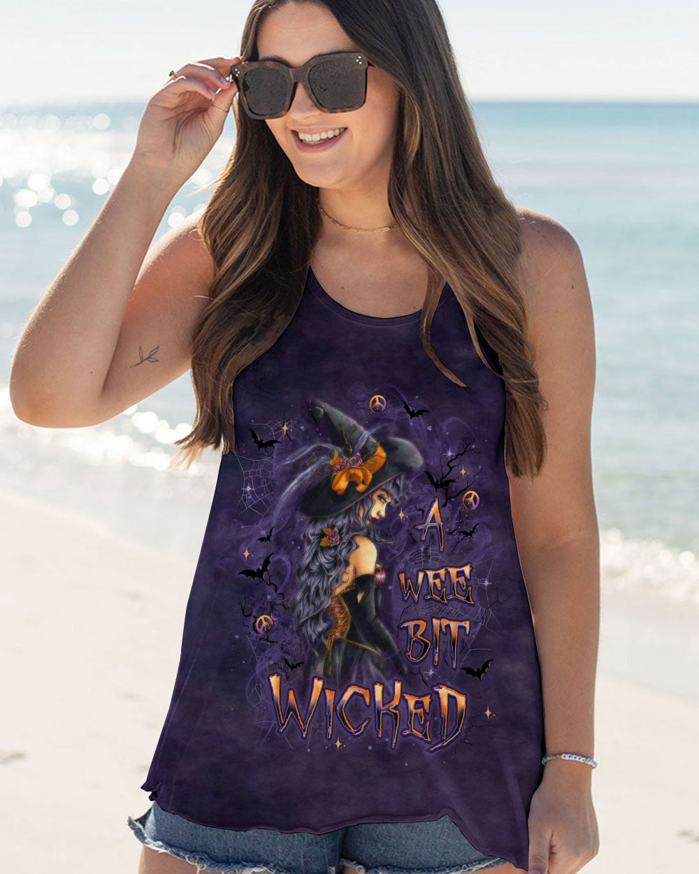 A Wee Bit Wicked Witch Shirt | All Over Print Dynamic pose of a model in the a wee bit wicked witch shirt, capturing the essence of Halloween fun.