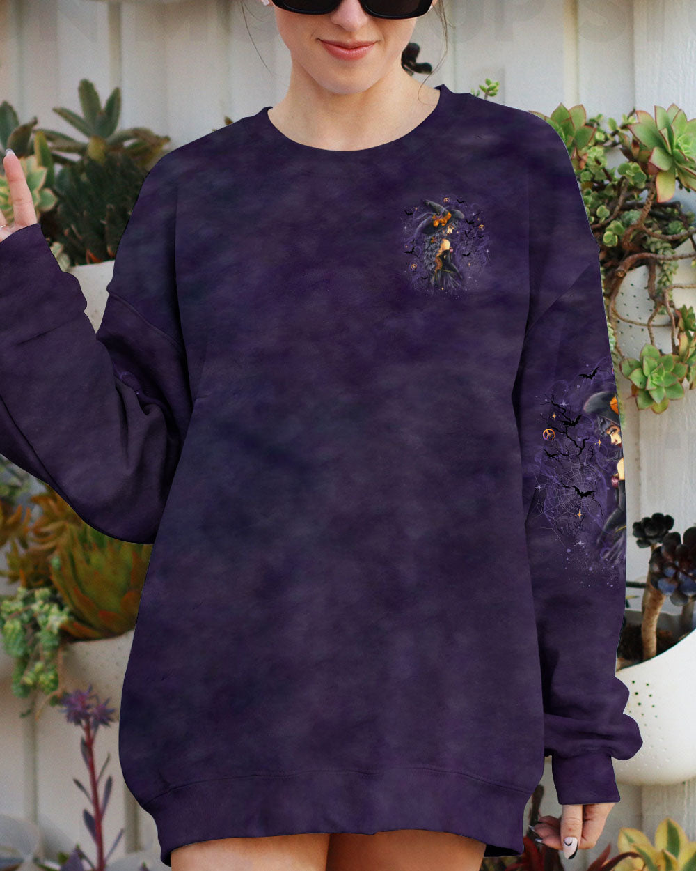 A Wee Bit Wicked Witch Shirt | All Over Print Zoomed-in shot of the vibrant colors on the a wee bit wicked witch shirt, highlighting its eye-catching design.
