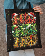 Front view of the hohoho peace christmas tote bag featuring bright colors and festive designs on a black background.