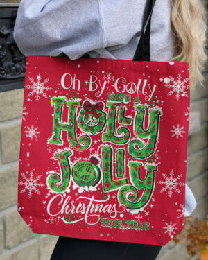 Front view of the red OH BY GOLLY CHRISTMAS TOTE BAG with festive lettering and snowflake designs.