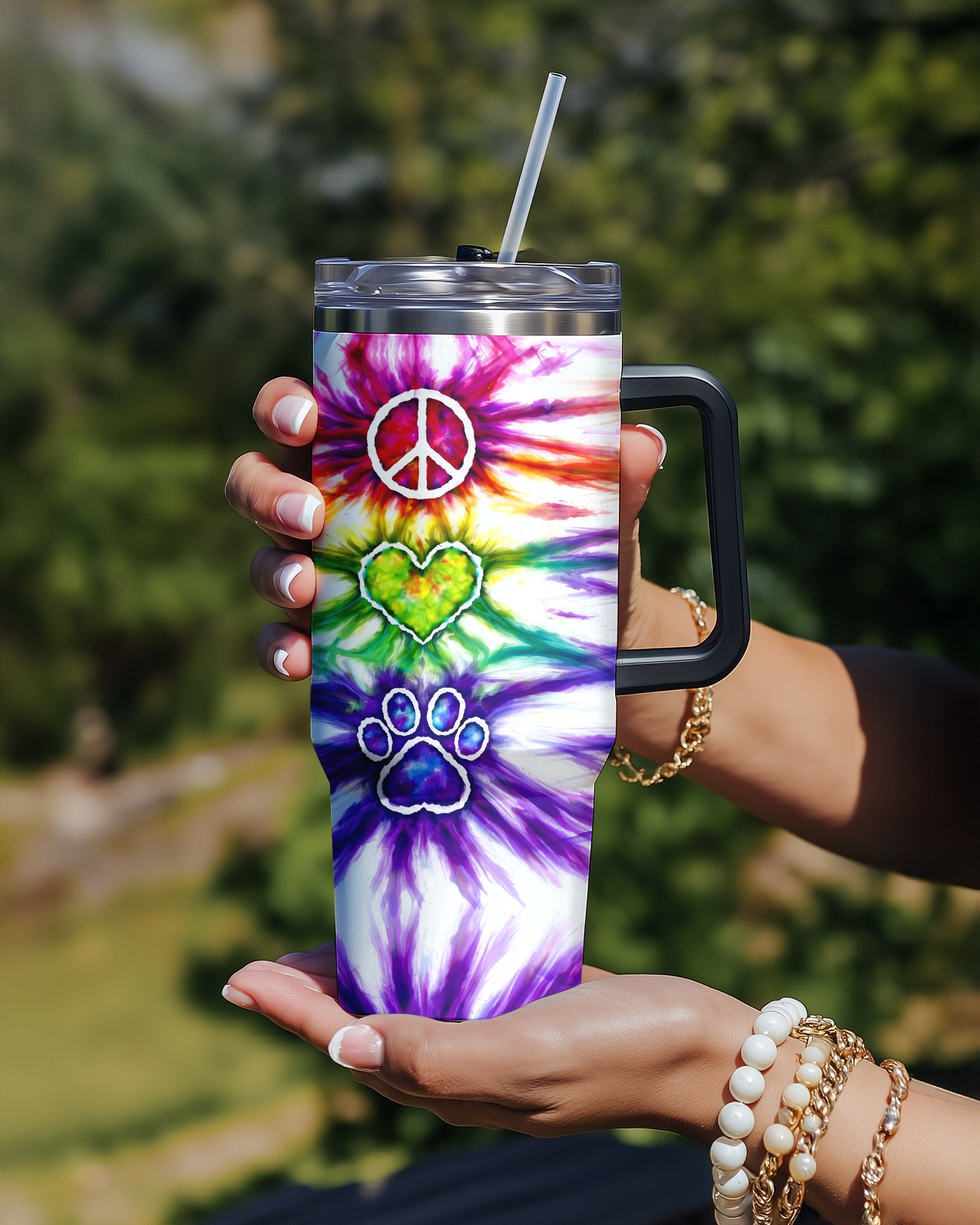 Peace Love Paw Print Swirl Tumbler Front view of the peace love paw print swirl tumbler showcasing vibrant tie-dye colors and playful designs.