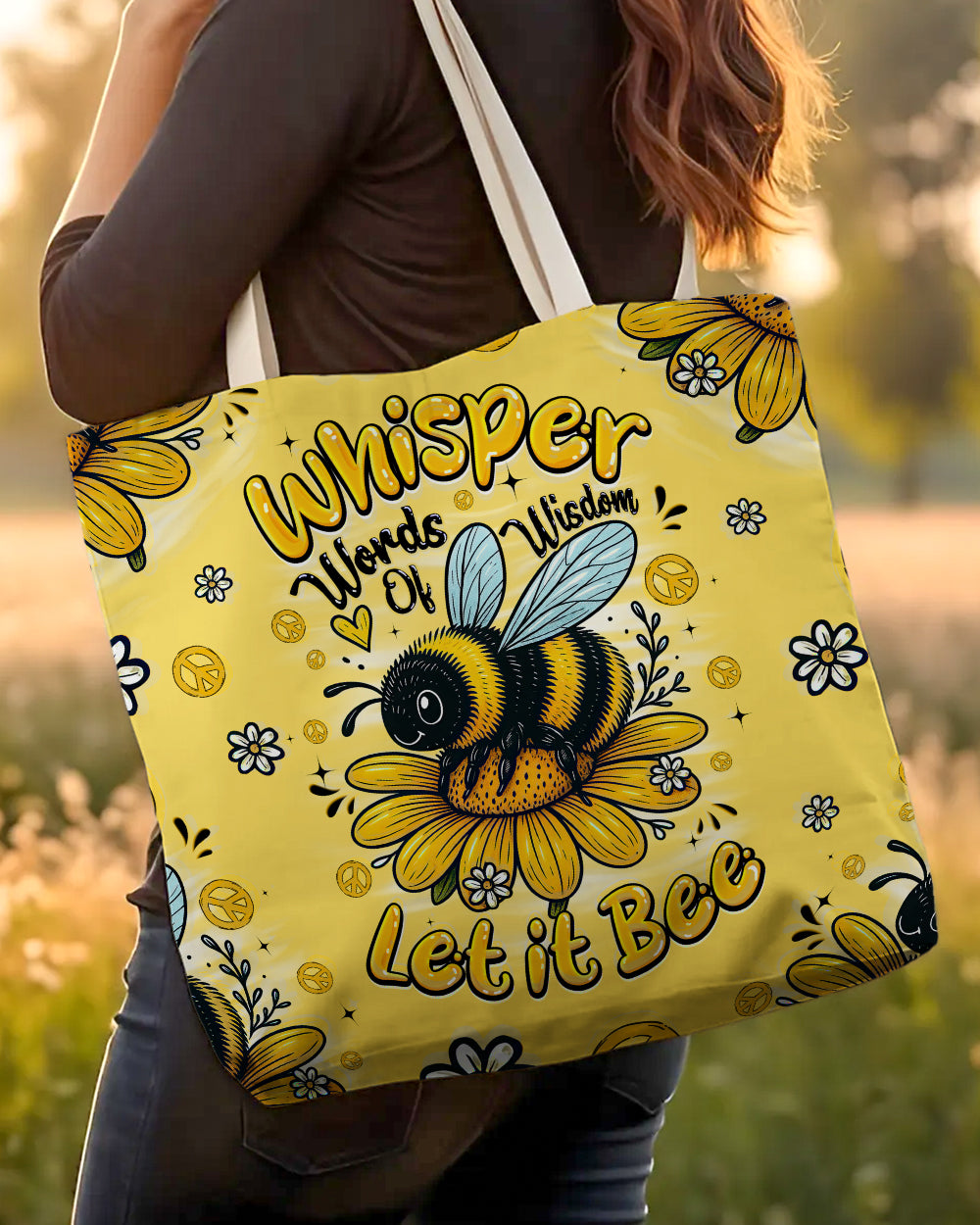Let It Bee Tote Bag | Whimsical Floral Design Close-up detail of the Let It Bee tote bag's design, highlighting the bee and floral patterns on a sunny yellow background.