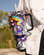 Front view of the scratching cat galaxy tumbler showcasing vibrant colors and a cosmic design with a sturdy handle.