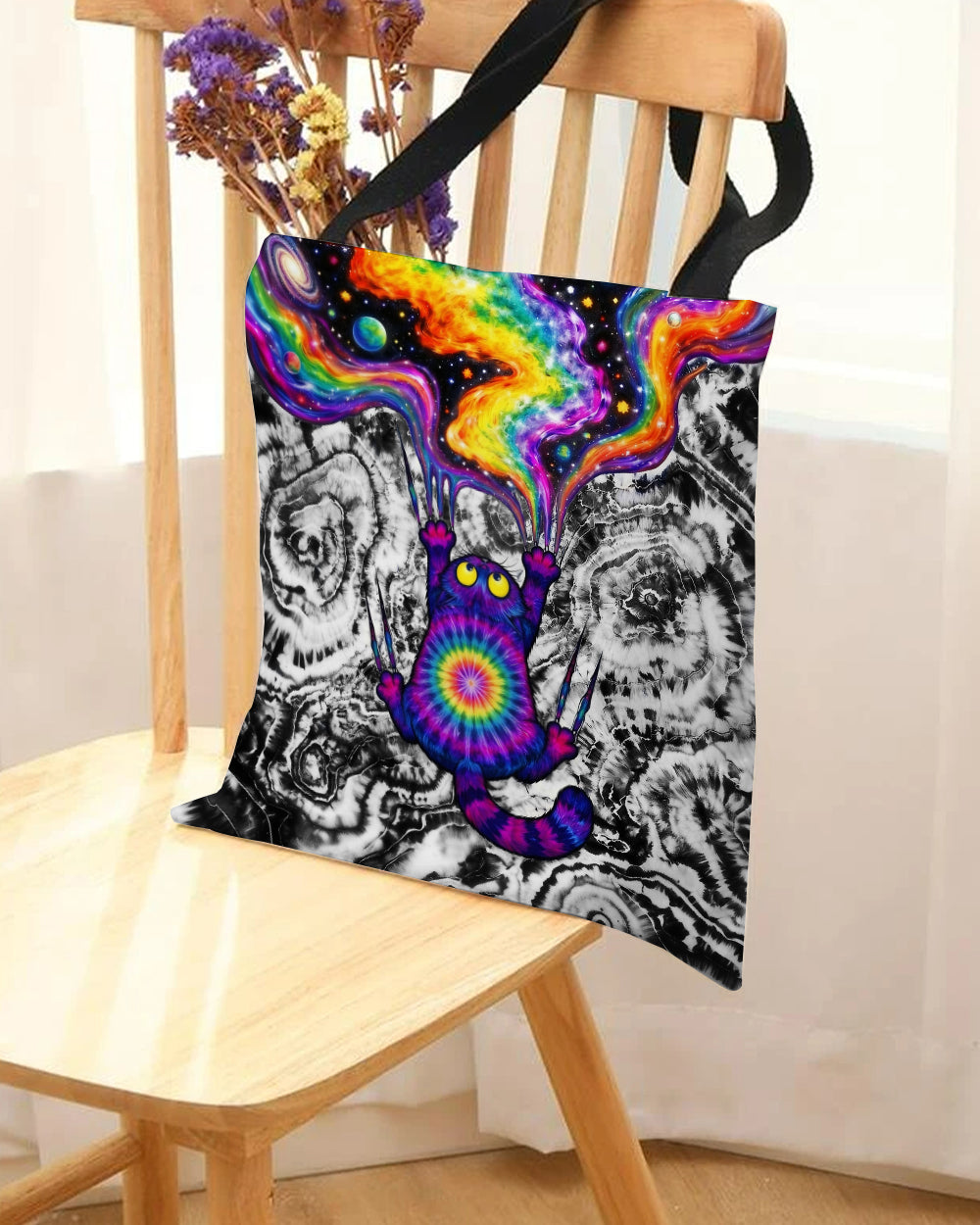 Scratching Cat Galaxy Tote Bag Back view of the scratching cat galaxy tote bag featuring a unique tie-dye pattern and sturdy black straps.
