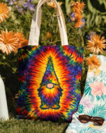 Colorful gnome hippie swirl tote bag featuring a vibrant tie-dye design, displayed against a floral background.