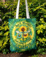 Front view of the Just Breathe Dragonfly Floral Swirl Tote Bag featuring vibrant sunflowers and a colorful swirl design.
