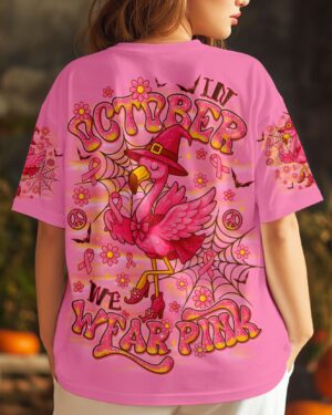 Back view of the pink flamingo witch shirt featuring vibrant designs and October-themed graphics.