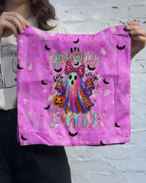 Front view of the IN OCTOBER WE WEAR PINK BOO tote bag showcasing a colorful ghost design on a vibrant pink background.
