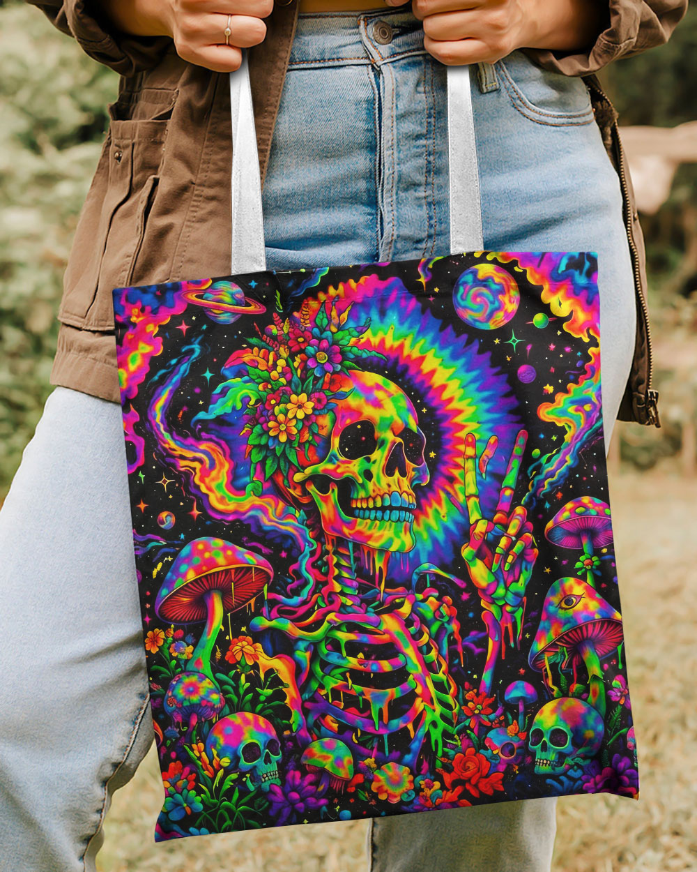 Hippie Skull Psychedelic Tote Bag Colorful hippie skull psychedelic tote bag held at an angle, showcasing vibrant floral and cosmic designs.