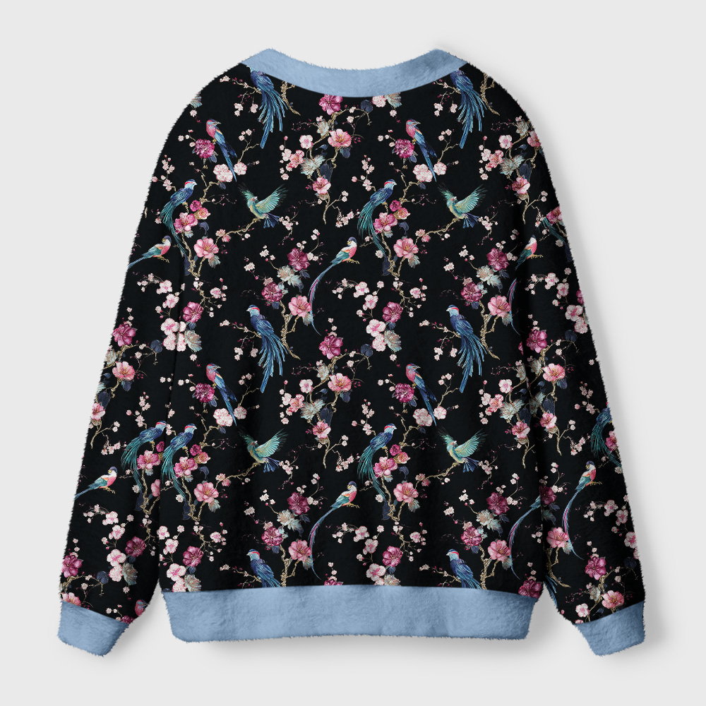 Birds and Blooms Cardigan Sweater Back view of the Birds & Blooms cardigan sweater showcasing vibrant bird patterns and cozy, relaxed fit.