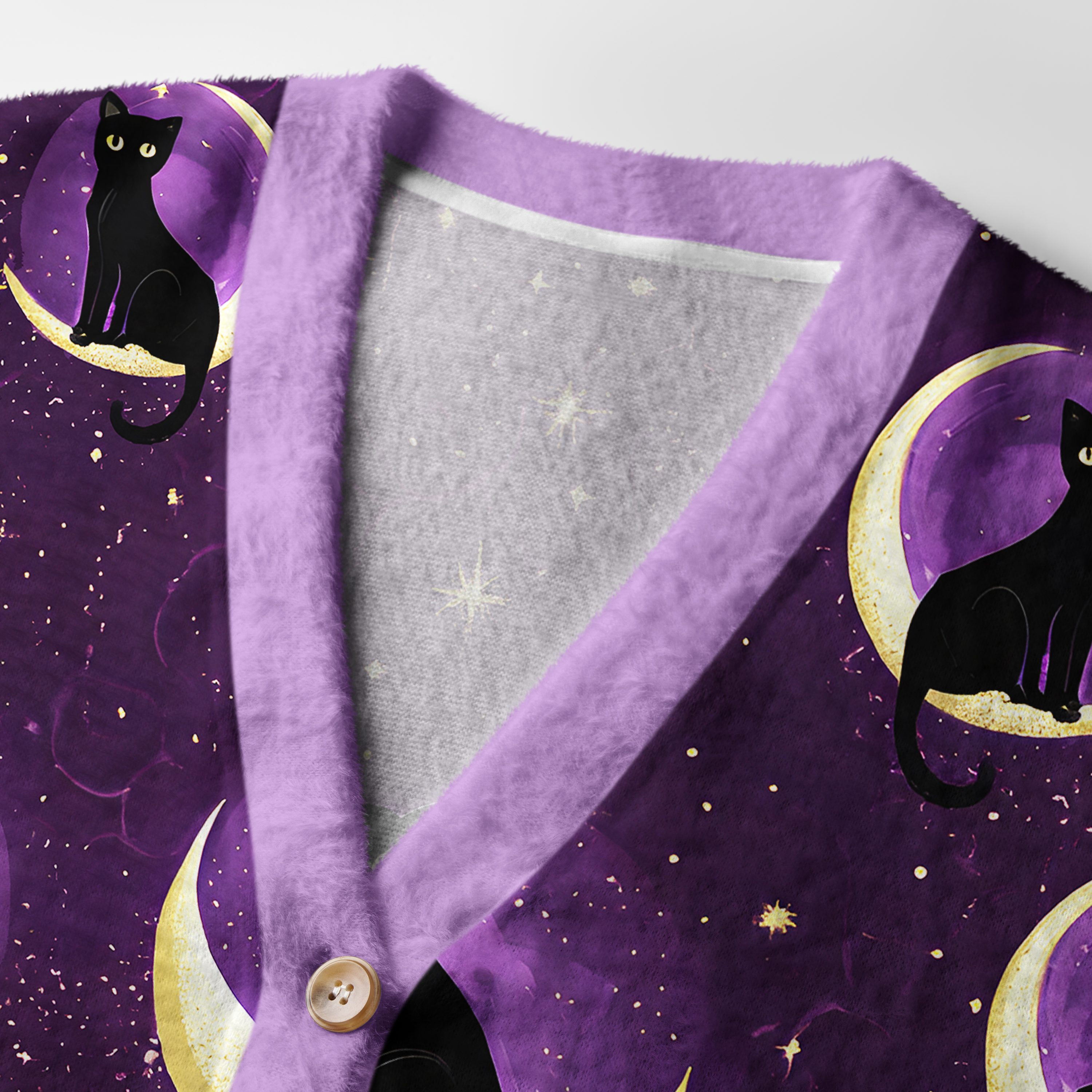 Moon Cat Cardigan Sweater | Celestial Cat Design Close-up detail of the moon cat cardigan sweater highlighting the soft texture and intricate celestial cat graphics.