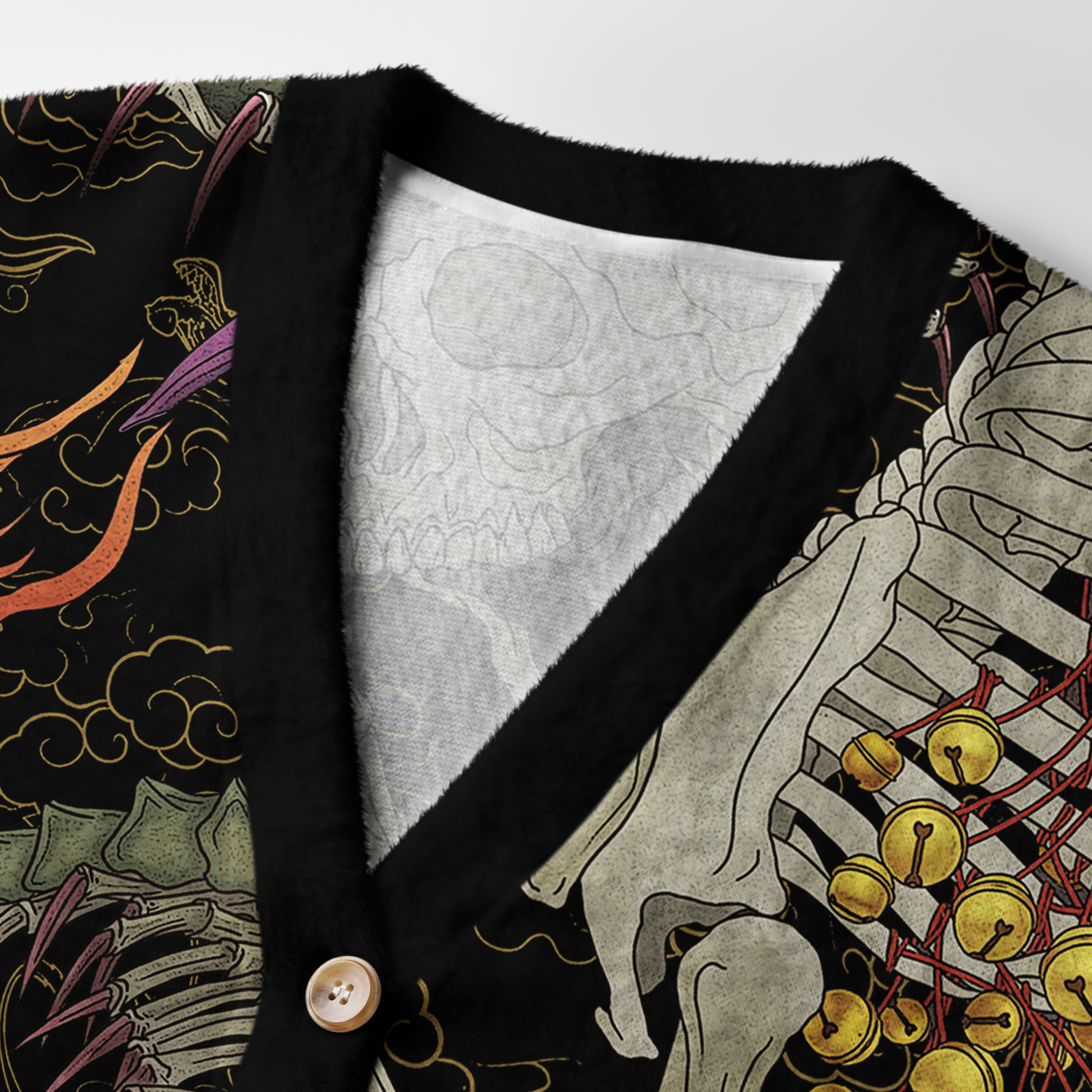 Yokai & Skeletons Cardigan Sweater Close-up detail of the yokai & skeletons cardigan sweater highlighting the vivid artwork and texture of the fabric.