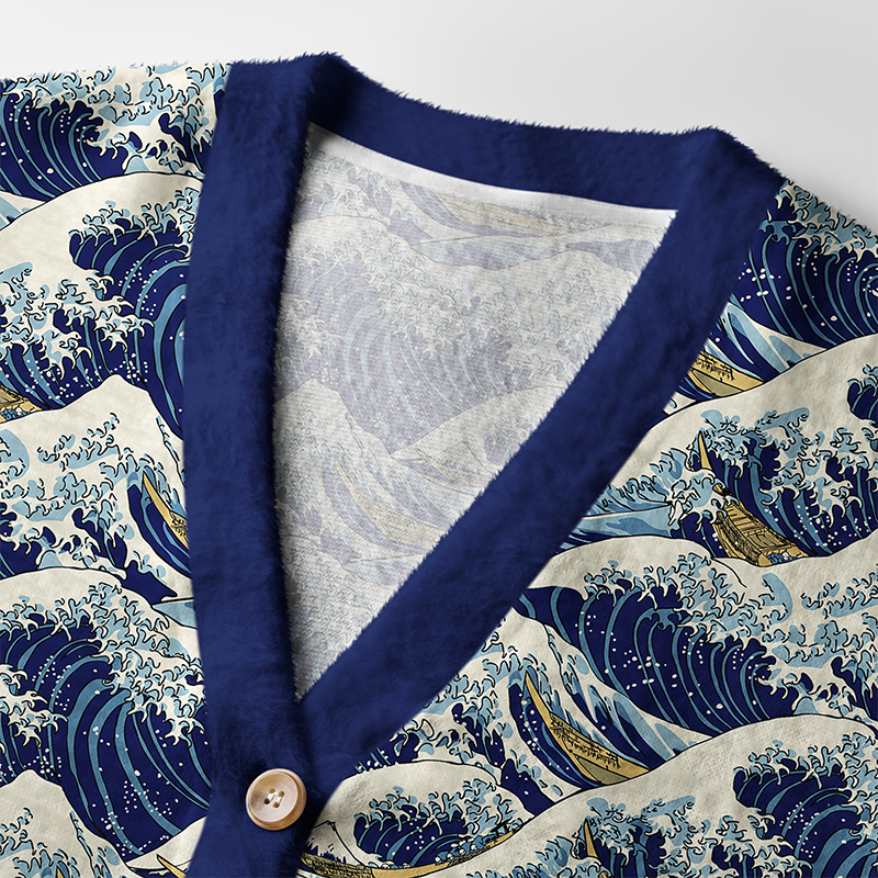 Japanese Great Wave Cardigan Sweater Close-up detail of the Japanese Great Wave Cardigan Sweater highlighting the intricate wave design and button features.