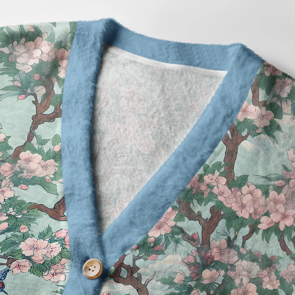 Birds Under Sakura Cardigan Sweater Close-up detail of the birds under sakura cardigan sweater highlighting the vibrant colors and floral elements.