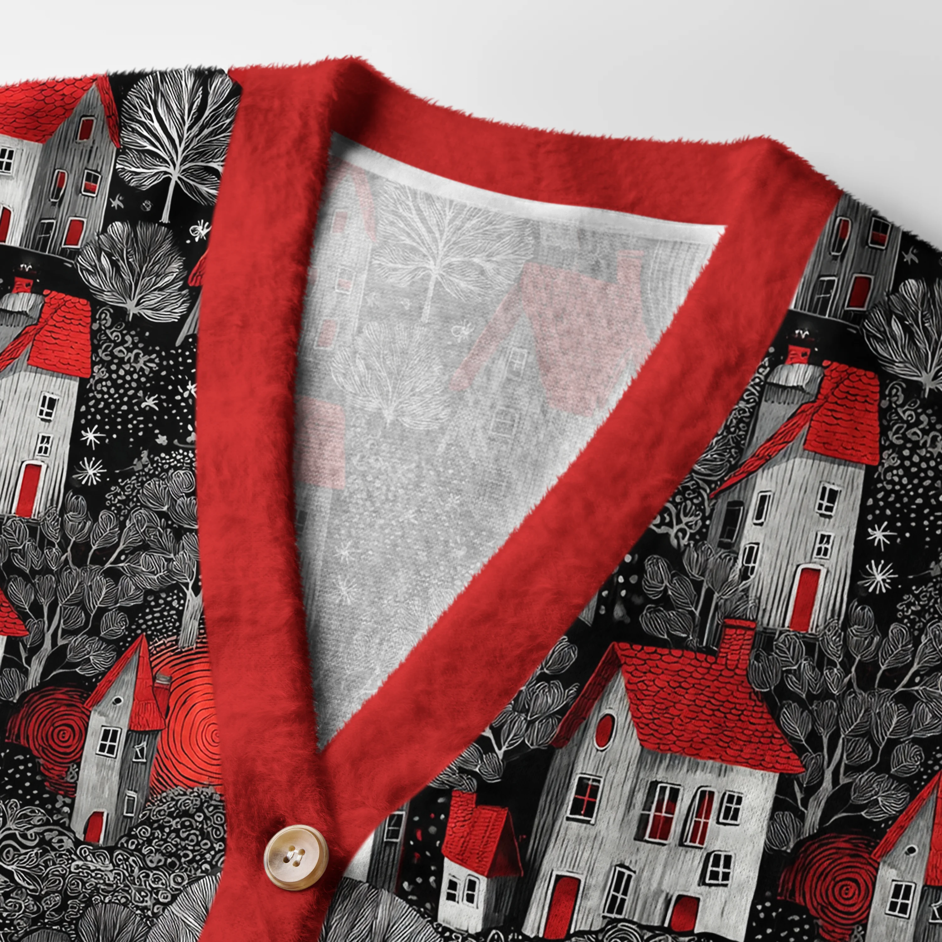 Enchanted Red & Black Village Cardigan Close-up detail of the enchanted red black village cardigan highlighting the unique button design and intricate patterns.
