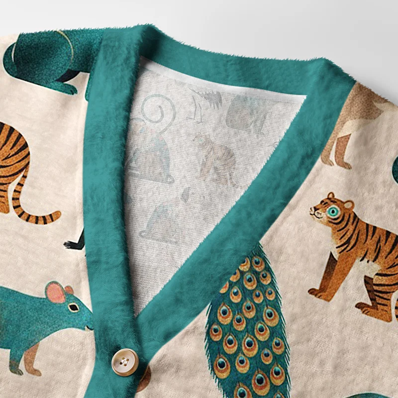 Colorful Wildlife Cardigan Sweater Close-up detail of the colorful wildlife cardigan sweater's buttons and unique wildlife illustrations on soft fabric.