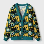 Surprised cat cardigan sweater in teal with vibrant cat faces, showcasing a fun and quirky design from the front view.