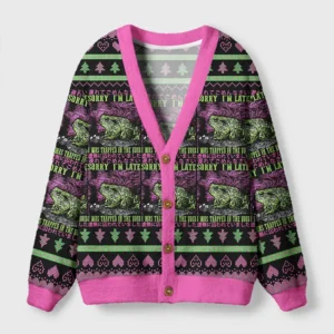 Frogs in the void cardigan sweater features a vibrant pink trim and surreal frog design from the front view.