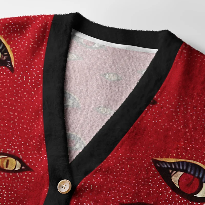 Mysterious Cat Cardigan Sweater | Artistic Cat Design Close-up detail of the mysterious cat cardigan sweater highlighting the intricate artwork and button features.